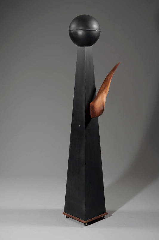 Title unknown (wood, metal, paint abstract sculpture on base with wheels)