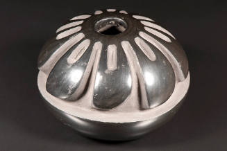 Title unknown (small shiny black vessel with depressed design)
