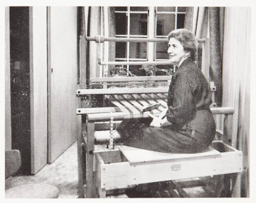 Christmas card (photograph of Mary Helm at loom)