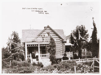 Summer view of yard and Cabin Home, Thos Bearth and Nora Francis on upper porch