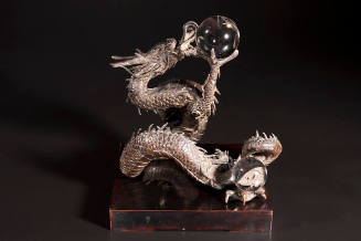 Dragon with three crystal rock spheres