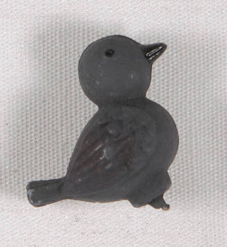Untitled (miniature plastic bird)