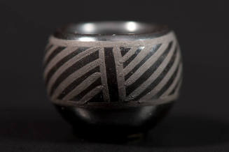 Miniature black painted vessel