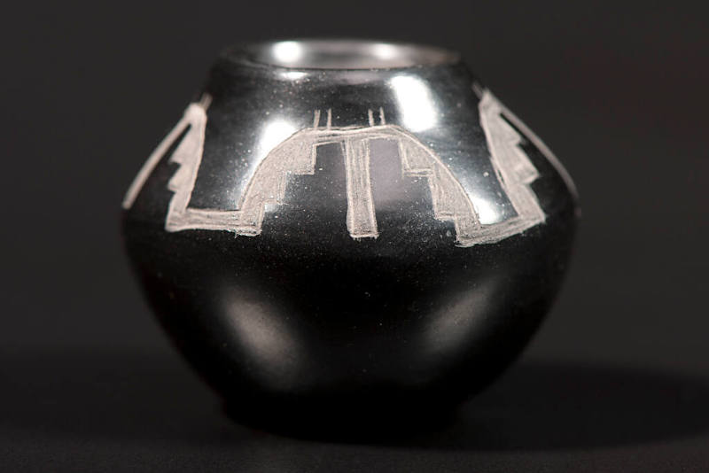 Carved blackware jar