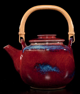 Title unknown (bamboo handled burgundy teapot with blue accents)