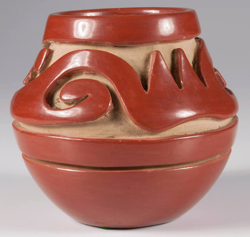 Carved redware jar