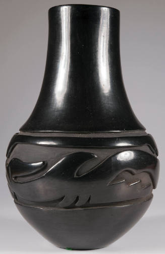 Blackware vase with carved design