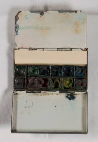 Miniature watercolor set with metal case, watercolor cakes, and brushes