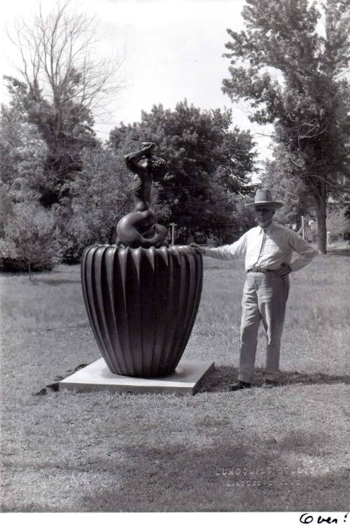 Birger Sandzén in his garden. Triton Urn by Carl Milles now at Texas Centennial Central Exposition, Dallas Texas.