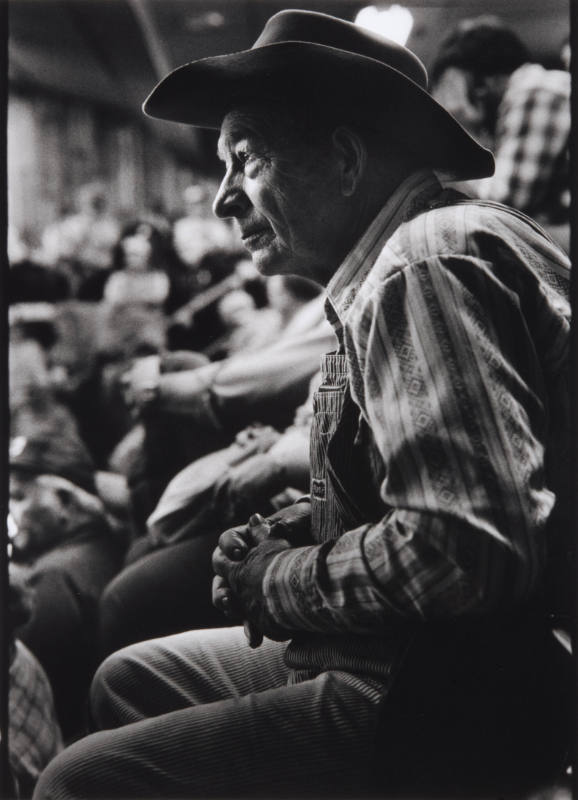 Title unknown (profile of man wearing overalls and western hat)