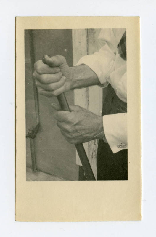 Hands grasping a pole