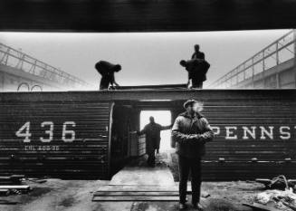 Title unknown (men with railroad car, New York, 1957)