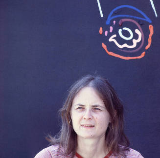 Margo Kren (painting professor, Kansas State University), in back of Kren home, Bertrand Street, Manhattan, Kansas, Spring 1982