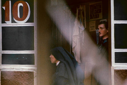 Nun Passing Store Window, Brazil, 1947