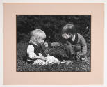 Pete Souza, title unknown (two children smelling flowers outdoors), ca. 1975, gelatin silver pr…