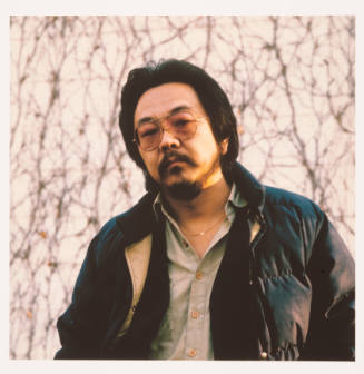 Roger Shimomura (artist, painting professor, University of Kansas), back of Kren home, Bertrand Street, Manhattan, Kansas, March 5, 1981