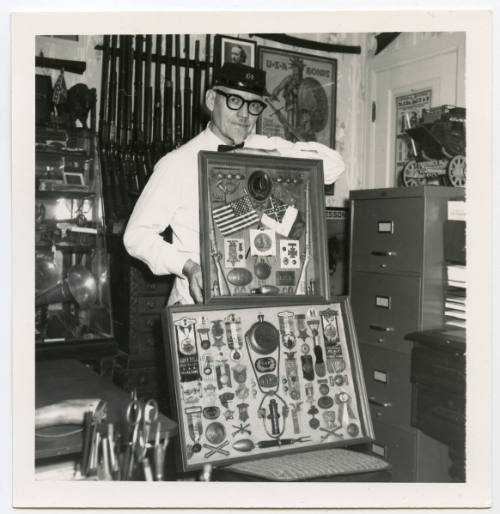 Herschel C. Logan posing with Civil War Memorbilia