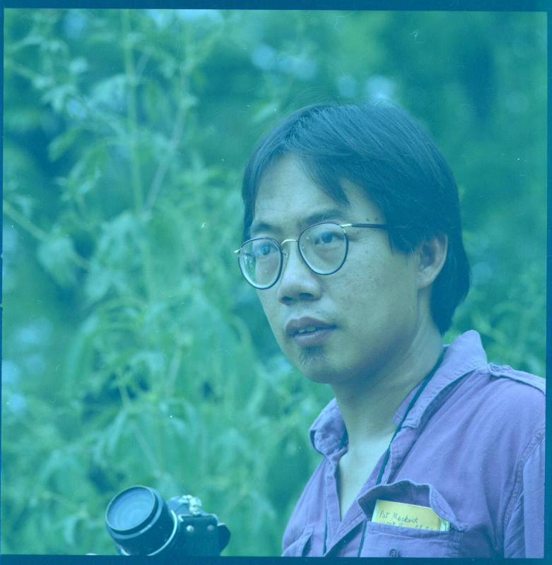 Pok Chi Lau (photography professor, University of Kansas), outside a family residence, Lawrence, Kansas, August 18, 1984