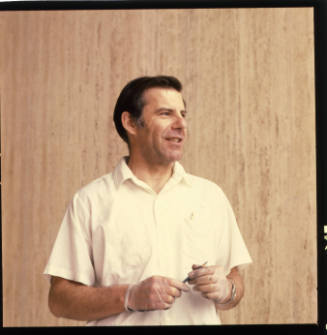 Ed Navone (painting professor, Washburn University), lobby of Meelvane Art Museum, Topeka, Kansas, February 27, 1984