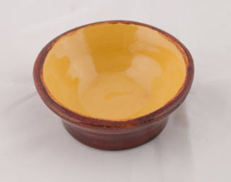 Small brown and yellow ceramic bowl