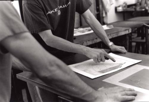 James Munce and his student, Steve Laughlin, are looking at Steve's lithograph print.