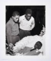 Gordon Roger Alexander Buchanan Parks, In mortuary Red and Herbie Levy study wounds on face of …