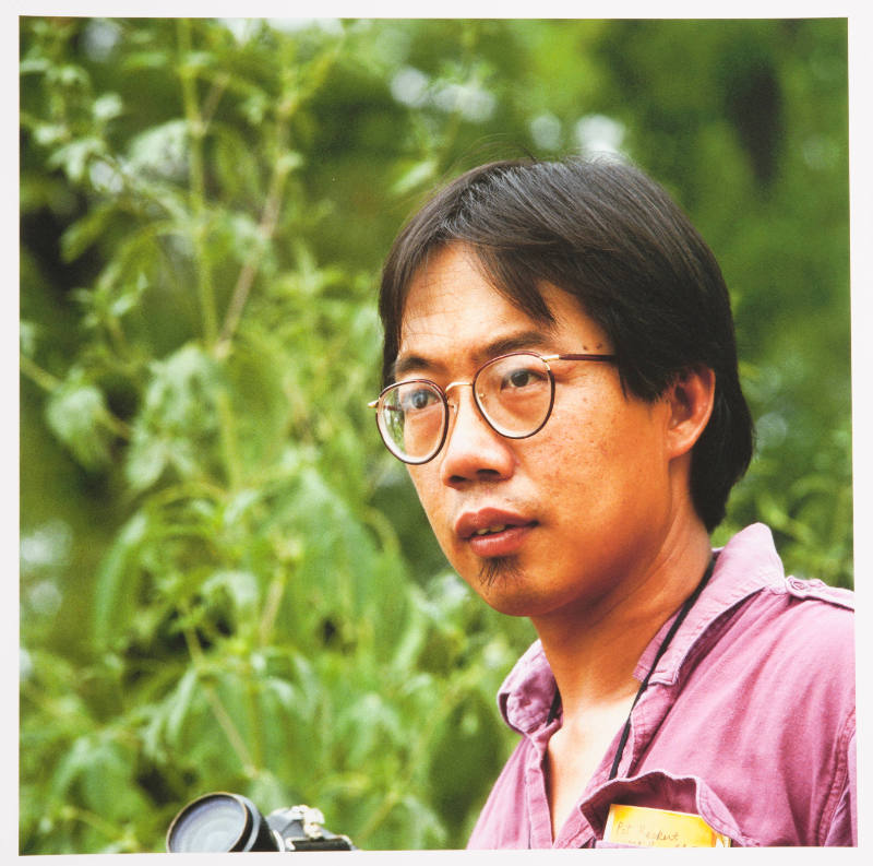 Pok Chi Lau (photography professor, University of Kansas), outside a family residence, Lawrence, Kansas, August 18, 1984